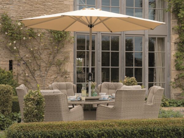 Bramblecrest Chedworth Sandstone Rattan 6 Seat Round Dining Set with Lazy Susan, Parasol & Base
